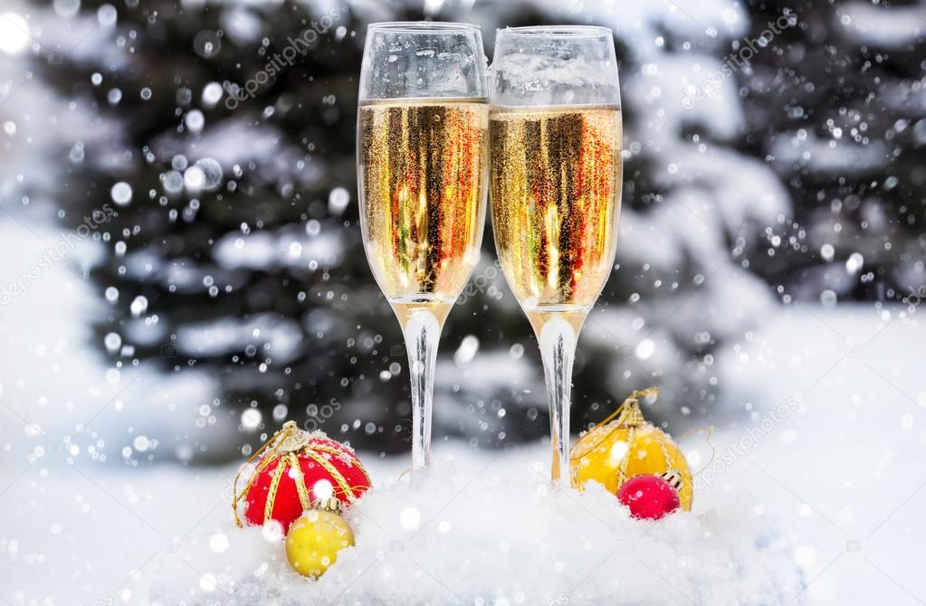 Two glasses with champagne on the snow