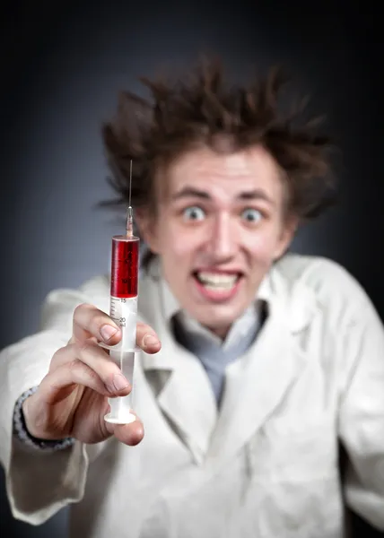 Crazy doctor with syringe — Stock Photo, Image