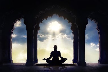 Meditating in old temple  clipart