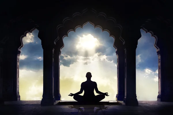 Meditating in old temple — Stock Photo, Image