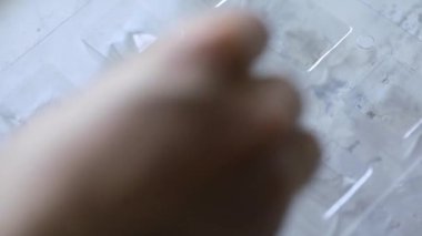 Woman make homemade chocolate candy with nuts