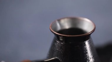 Making Turkish coffee in copper cezve