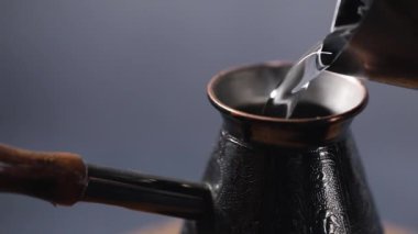 Making Turkish coffee in copper cezve