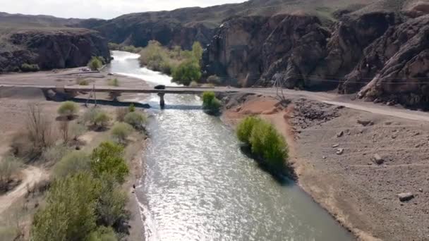 Drone shot of river Charyn Canyon desert mountains in Kazakhstan — Video