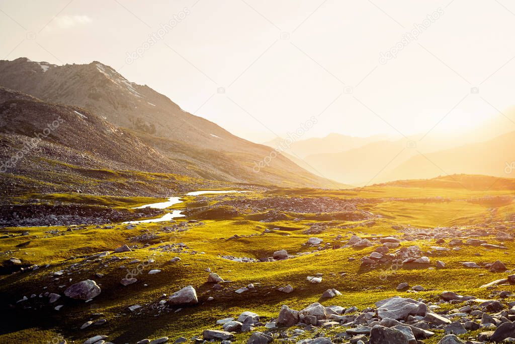 Beautiful scenery of the mountain valley with river at sunset in Almaty, Kazakhstan. Outdoor and hiking concept