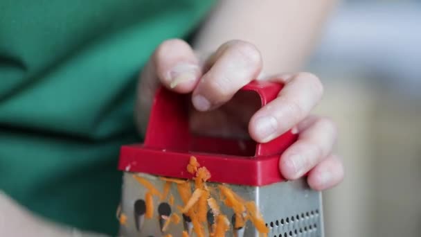 Cook Rubs Carrots Grater Close Kitchen — Stock Video