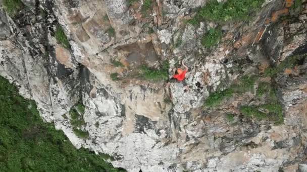 Drone Shot Strong Man Red Shirt Climbing High Rock Mountains — Video