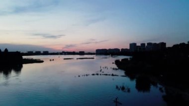 PeopleMan mountain lake Sairan in city Almaty in Kazakhstan. Drone shot aerial outdoo activity