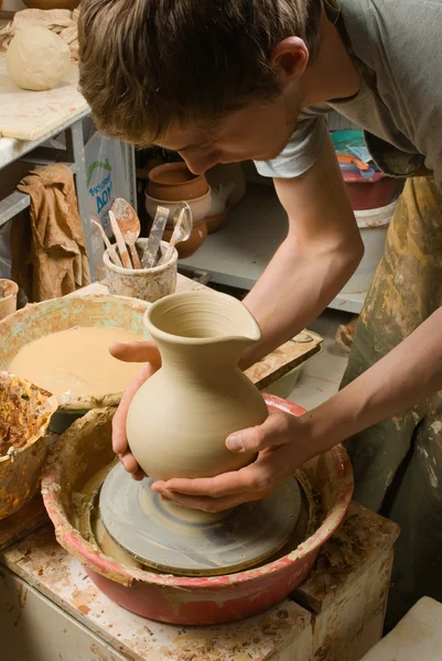 Hands of a potter, creating an earthen jar of white clay — Stock Photo, Image