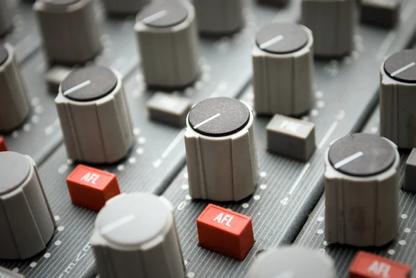 Sound mixer console with highlighted button, pump the volume — Stock Photo, Image