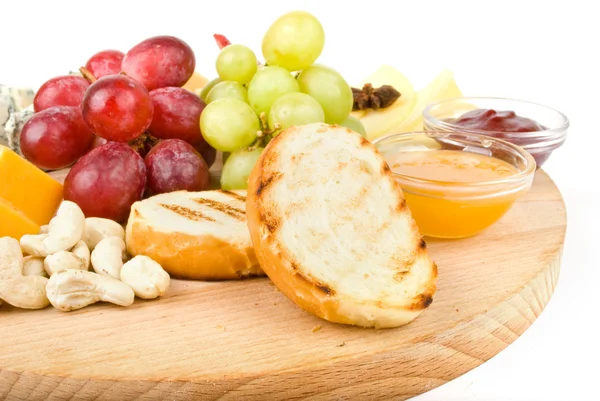 Isolated platter of assorted fruit and cheese — Stock Photo, Image