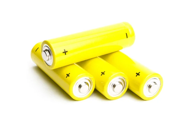 Yellow alkaline batteries isolated on white background Royalty Free Stock Photos