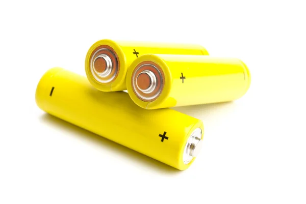 Yellow alkaline batteries isolated on white background Royalty Free Stock Images