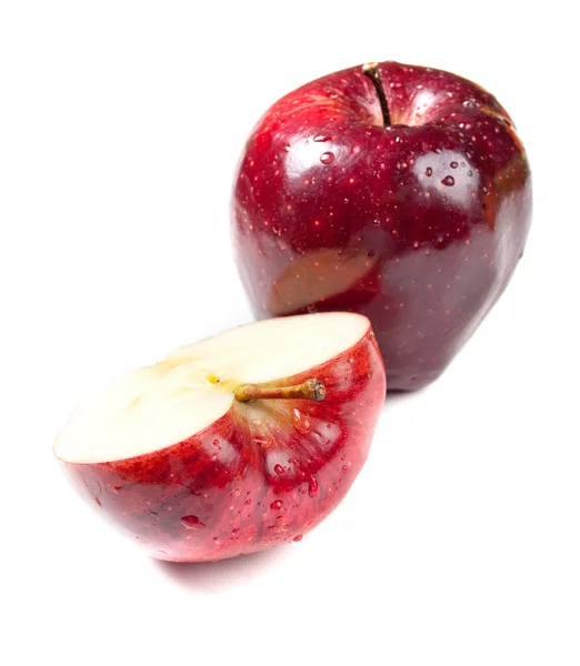 Apple with a slice lying nearby — Stock Photo, Image