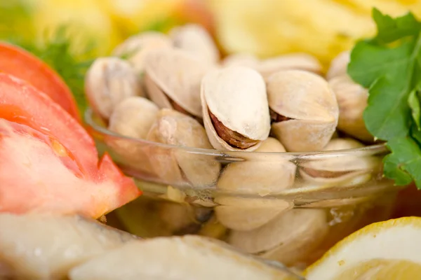 Pistachios and snacks — Stock Photo, Image