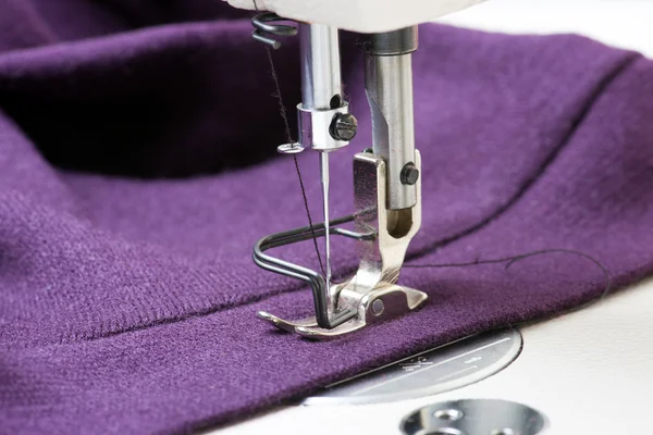 Hand sewing a material on a machine. — Stock Photo, Image