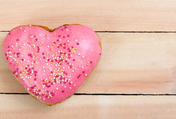 Donuts em um fundo de madeira — Fotografia de Stock