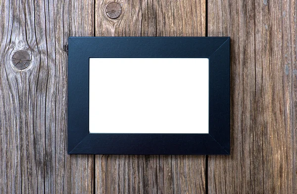 Black frame on wood background — Stock Photo, Image