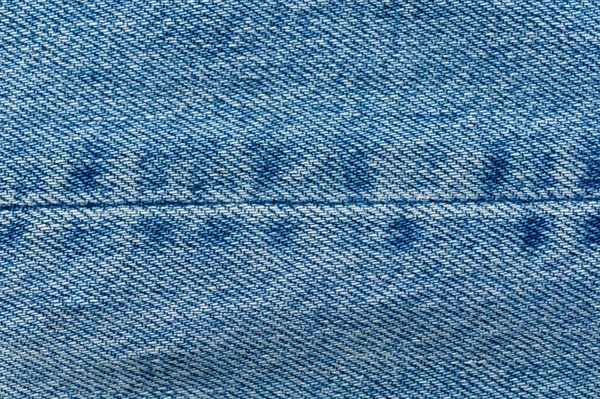 Džíny uzavírají pozadí. Šití džínů. Modrá tkanina Stock Obrázky