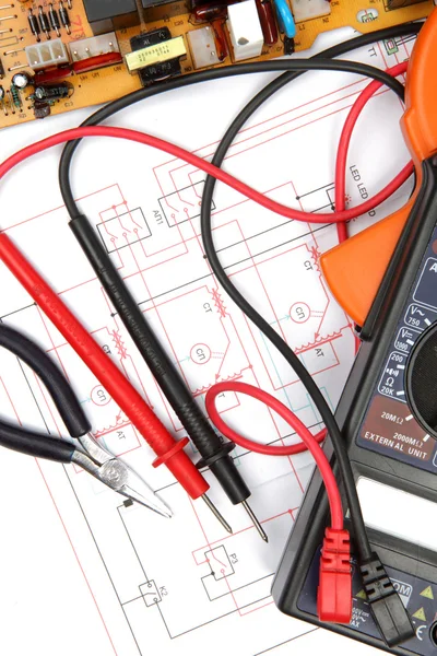 Digital multimeter and electronic circuitry — Stock Photo, Image