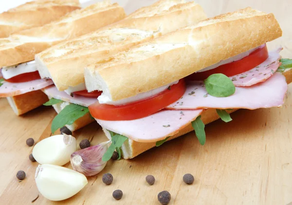 Three fresh sandwiches with tomato , ham and mozzarella — Stock Photo, Image