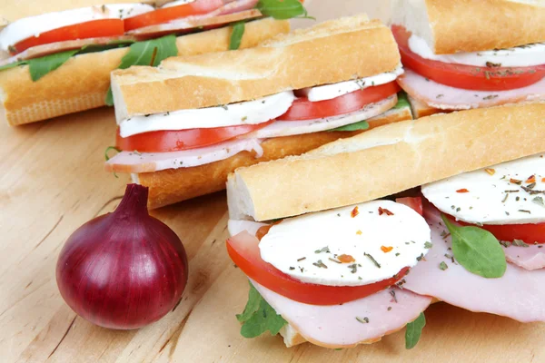 Three fresh sandwiches with tomato , ham and mozzarella — Stock Photo, Image