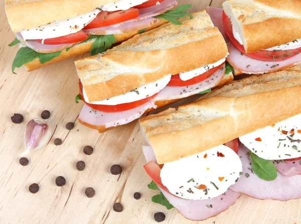 Three fresh sandwiches with tomato , ham and mozzarella — Stock Photo, Image