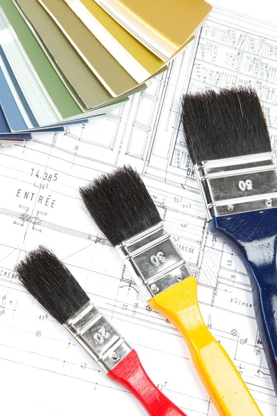 Tools and accessories for home renovation on an architectural drawing — Stock Photo, Image