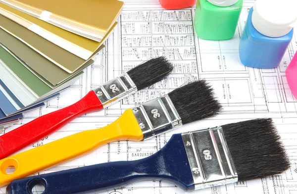 Tools and accessories for home renovation on an architectural drawing — Stock Photo, Image