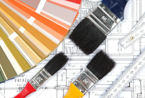 Tools and accessories for home renovation on an architectural drawing — Stock Photo, Image