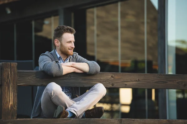 Portrait of handsome young man smiling outdoors — Stock Photo, Image