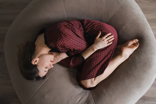 Woman sleeping sweet at home on a soft bean bag — Stock Photo, Image