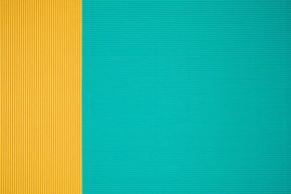 Turquoise and orange two tone color paper background with stripes. Abstract background modern hipster futuristic. Texture design