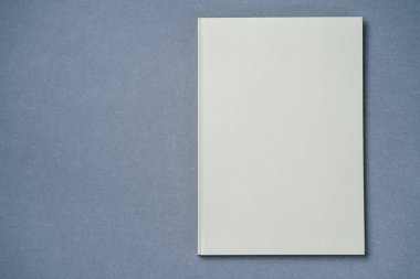 Leather notebook on paper gray background, notepad mock up, top view shot