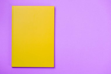 Orange Leather notebook on paper pink background, notepad mock up, top view shot