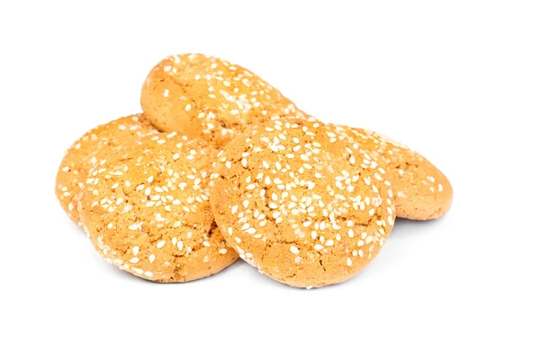 Biscoitos de aveia com sementes de gergelim isoladas em branco — Fotografia de Stock