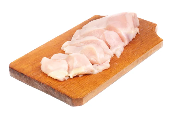 Chicken meat sliced on cutting board isolated on white background Stock Image