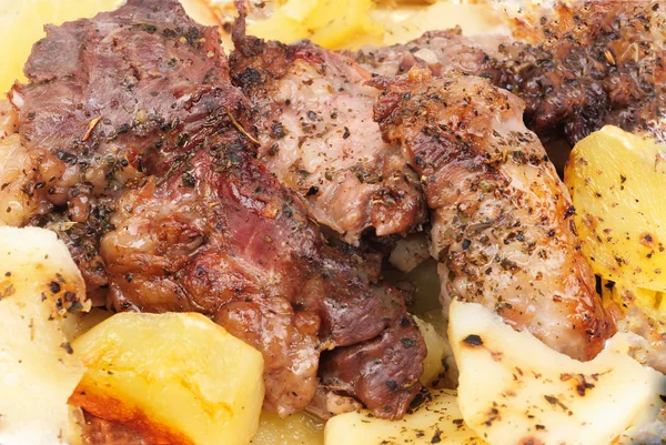 Barbecue meat with potato close-up as food background — Stock Photo, Image