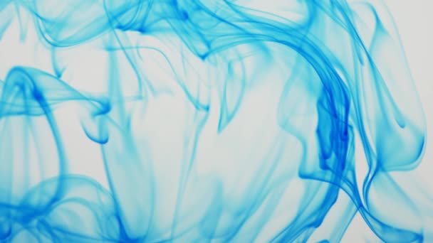 Spreading of blue paint in a liquid space. — Stock Video