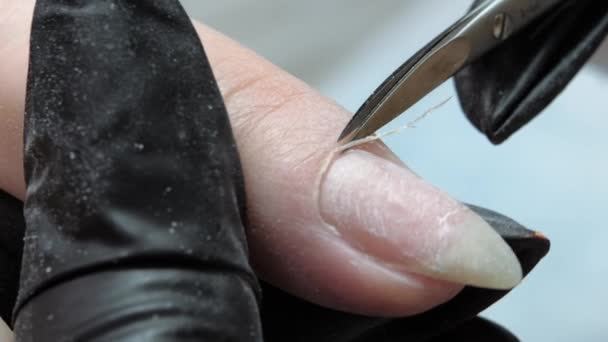 Pruning at the nail cuticle with manicure scissors. Hardware combined manicure. — Stock Video