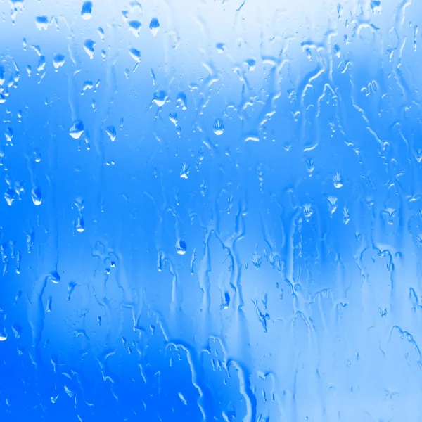 Fluyendo fondo de agua azul, fluyendo agua del vapor, fluyendo con el vaso de agua —  Fotos de Stock