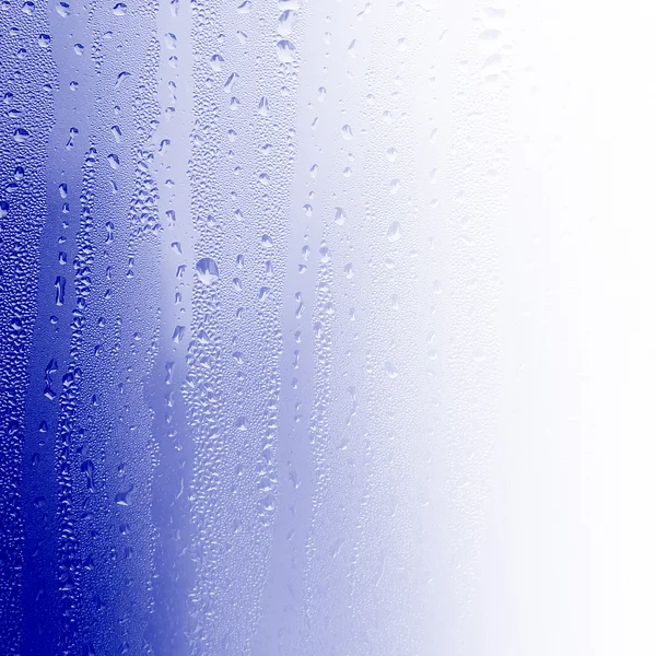 Água sobre vidro, fundo de água azul — Fotografia de Stock