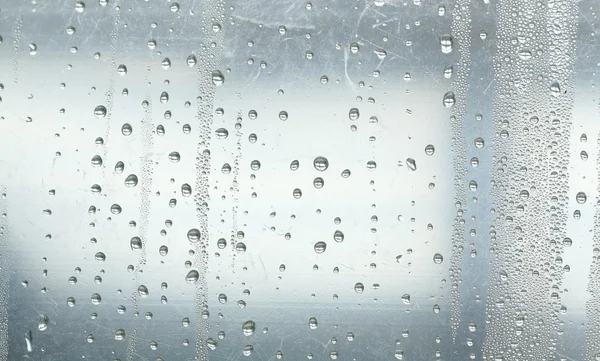 Gotas de agua sobre fondo gris —  Fotos de Stock