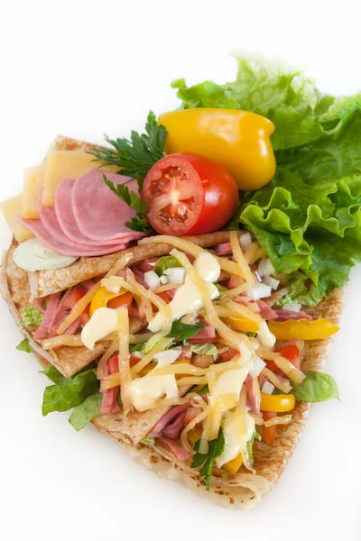 Thin pancakes with ham, cheese and vegetables — Stock Photo, Image