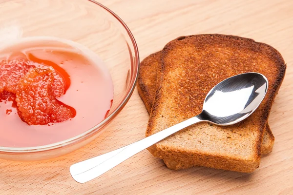 Toast from bread with jam and spoon — Stock Photo, Image