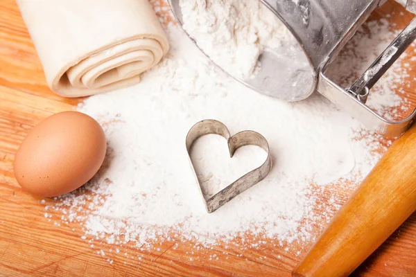 Pastry, rolling pin, eggs and figures for cookies — Stock Photo, Image