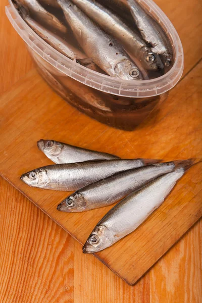 Salted anchovies in box on wooden — Stock Photo, Image