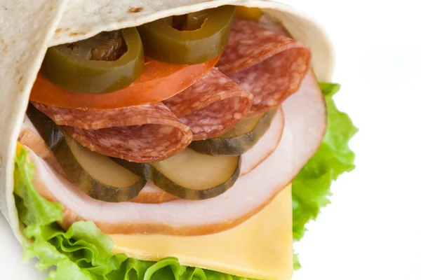Hot roll from lavash with sliced sausage and jalapeno — Stock Photo, Image