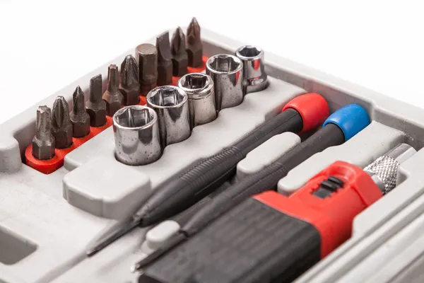 Open toolbox with screwdriver, heads and bit — Stock Photo, Image