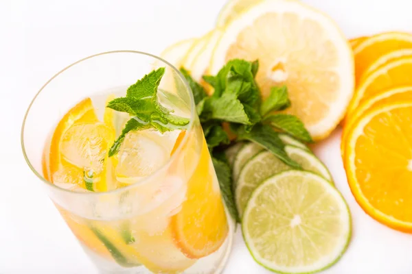 Fresh cold cocktail in glass with sliced citus — Stock Photo, Image